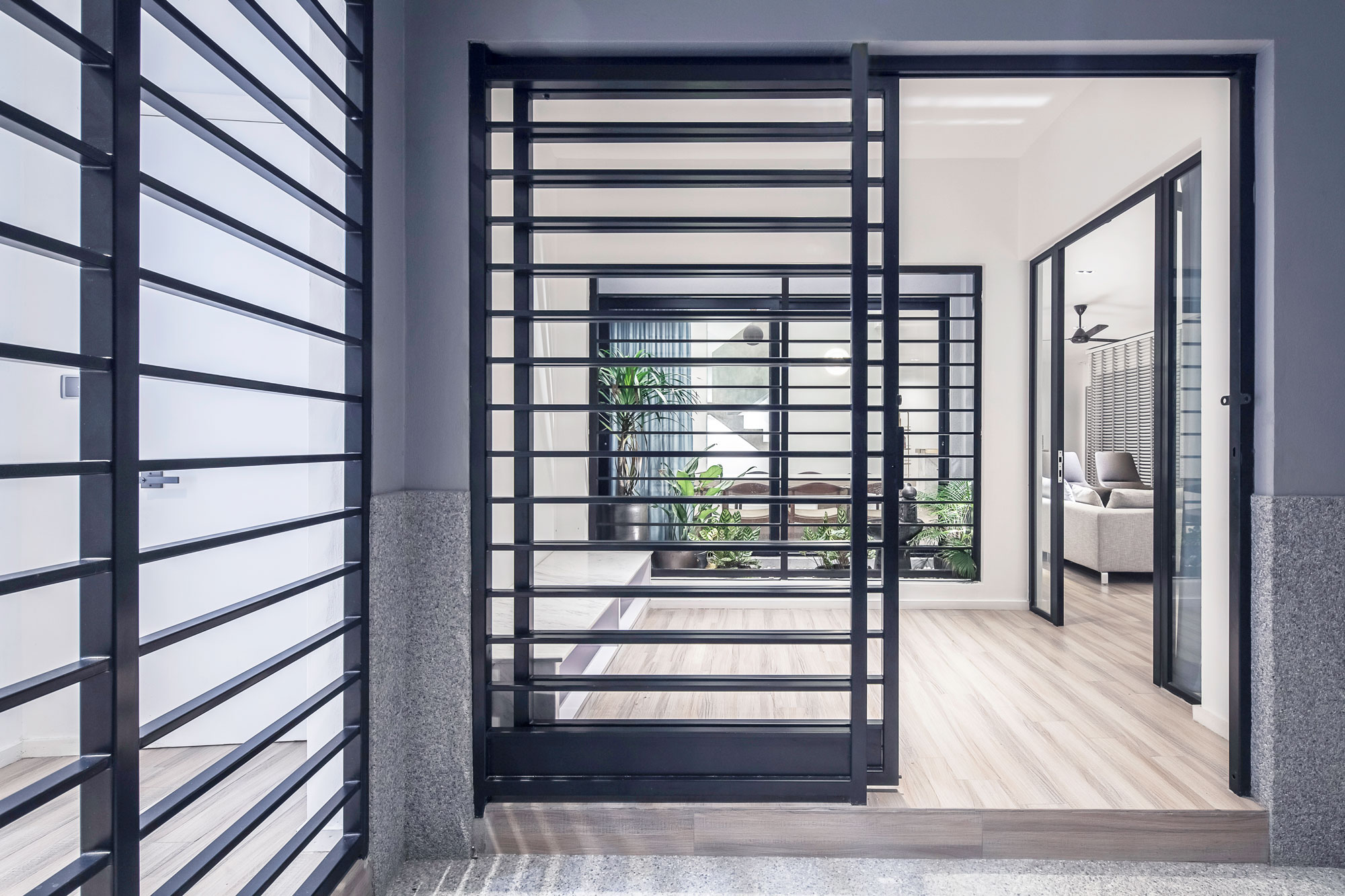 William Lim, father of Kevin Lim of openUU, and Vincent Lim of Lim and Lu, invites his sons to design a house together in Kuala Lumpur for his brother. William focuses on the architecture, while Kevin works on the interior design and Vincent on a feature bar. The result is a stunning 3 levels house with a central stairwell and atrium that connects 3 distinct functions on 3 levels: Live, Rest and Play.