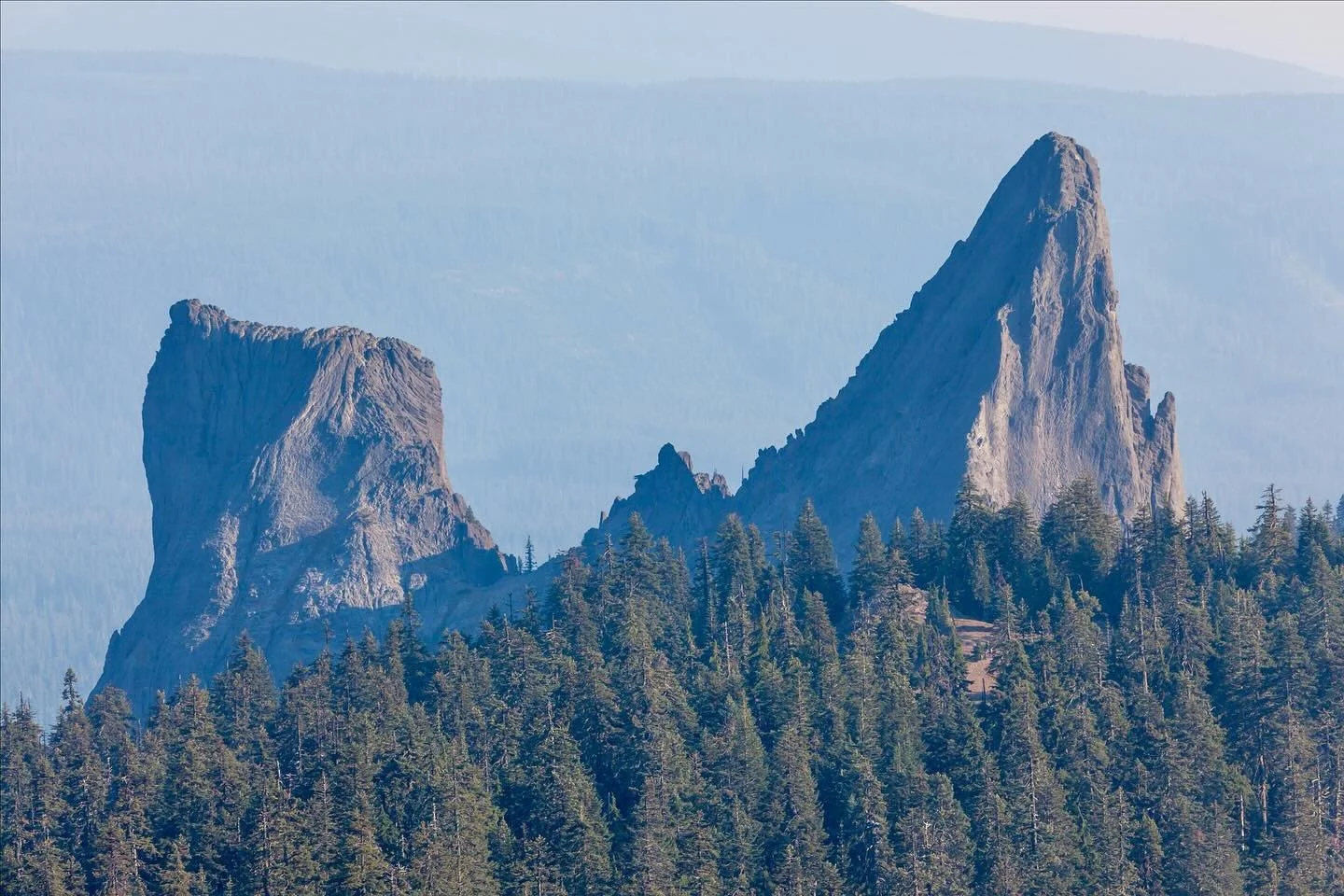From above, the Rabbit Ears rise dramatically out of the Southern Oregon Cascades &mdash; twin volcanic spires that look just like their name. Flying past them by helicopter gives you a rare view of these rugged lava plugs, a hidden landmark only a f