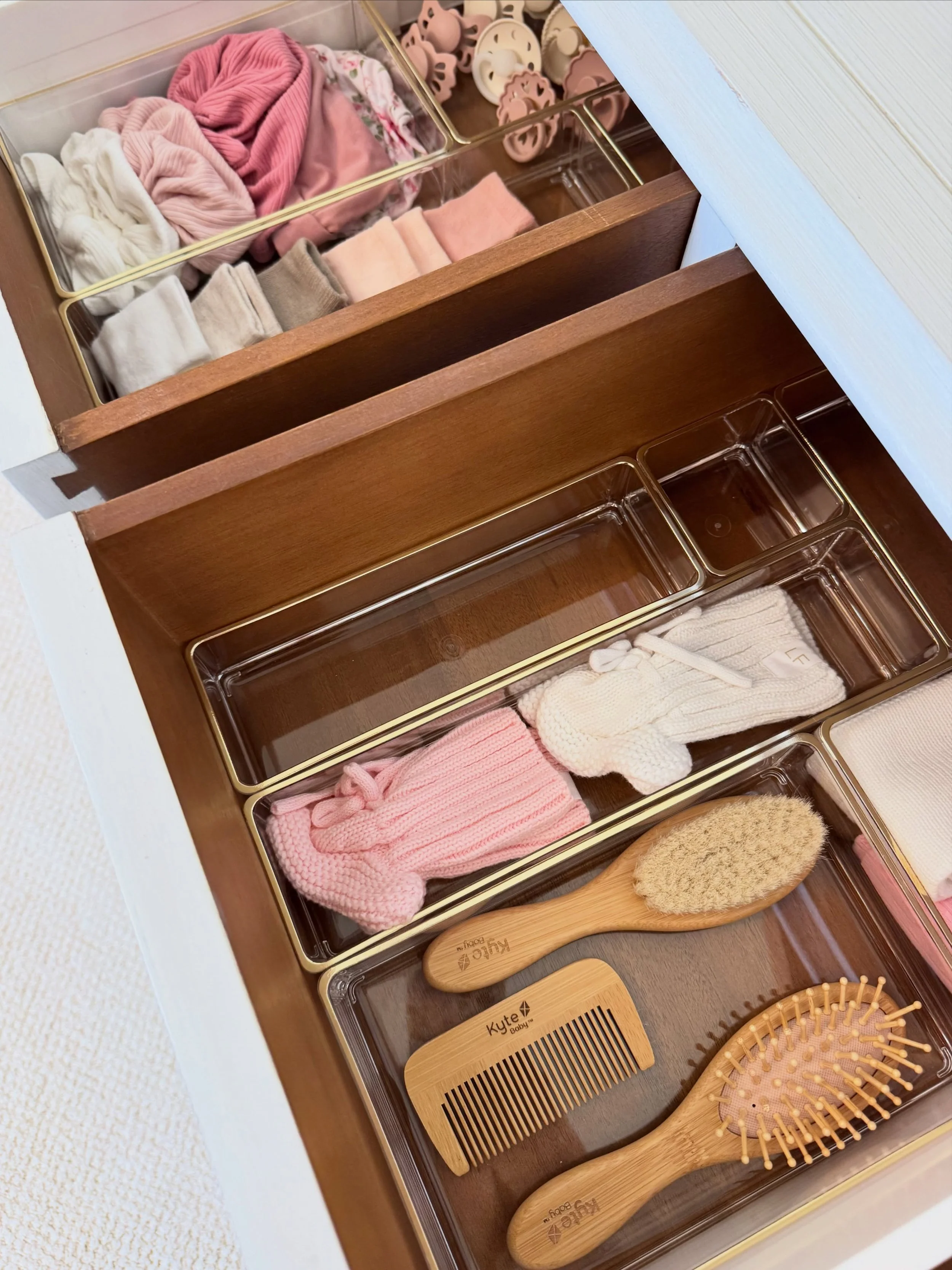Because chaos is not on the registry! Every tiny sock, every little comb, every pacifier in its place. This is what prepared looks like.

Nursery organization is one of our favorite projects because impact goes beyond aesthetics. It genuinely makes t