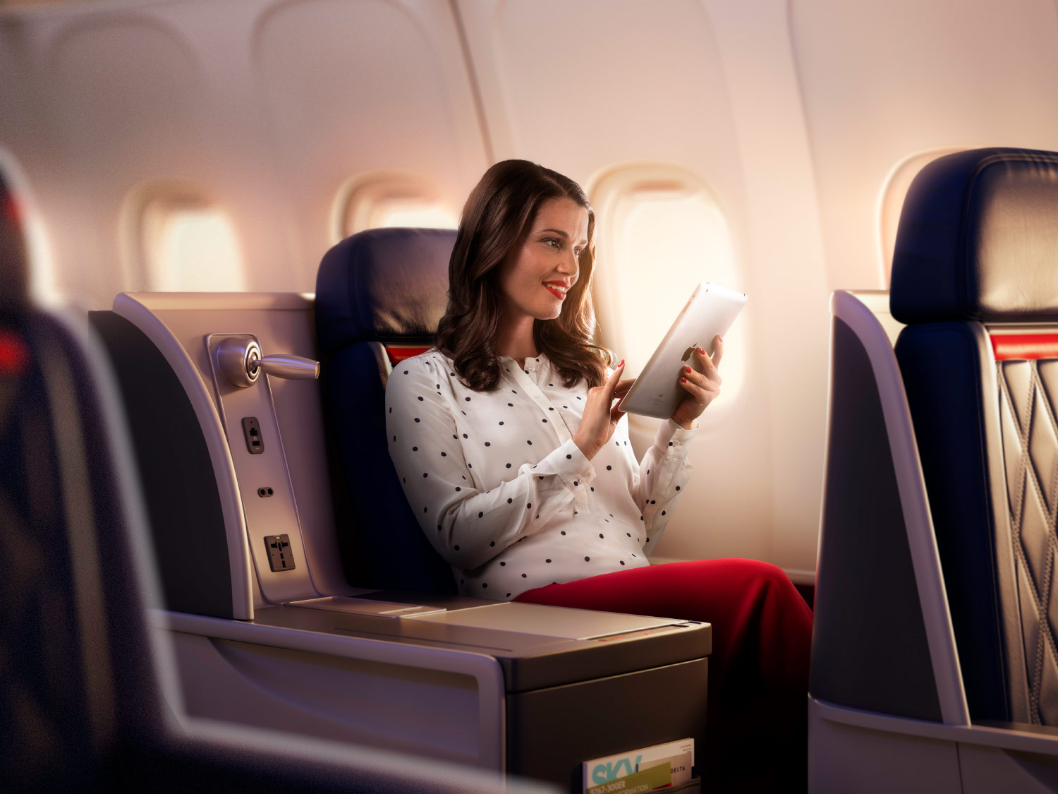 First class plus. Delta Airlines first class. Женщина в бизнес-классе. Advertising Airlines.