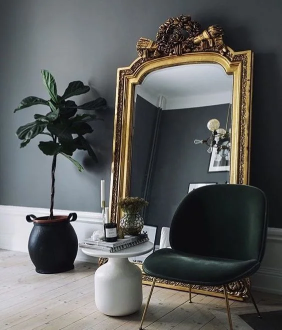 A SUBTLE gold mirror is a great touch for that ego.