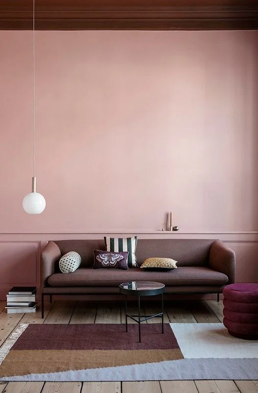 Soft blush pink walls with a faint texture create interest without cluttering. And I'm a sucker for a single, minimal pendant in lieu of a lamp!