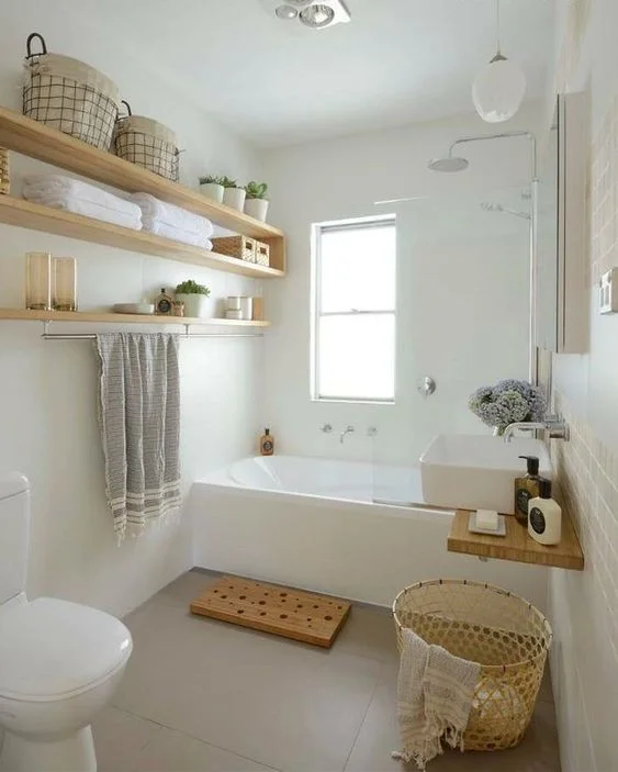 A clean bathroom, with everything open, airy and accessible.