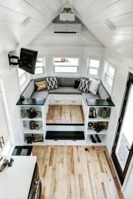 This entertainment area works hard as a social space, storage, and media center.