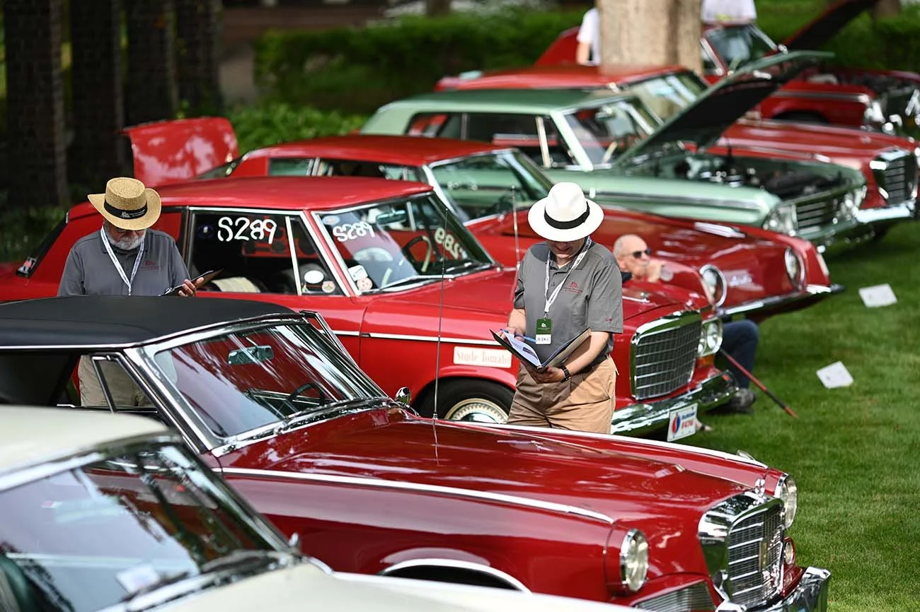 Our Concours judges have their work cut out for them as they inspect each vehicle on the show field.