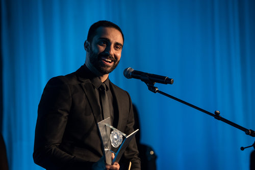 Lee Majdoub accepts his Leo Award for Best Guest Performance by a Male in a Dramatic Series for his role on Dirk Gently's Holistic Detective Agency.&nbsp;Photo by Wendy D Photography