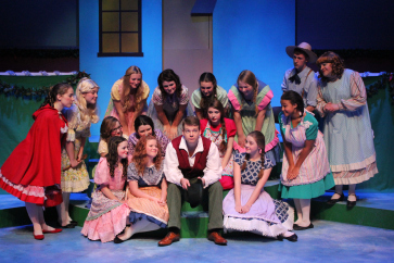 Will Nash Broyles as Tom Tom, Kenny Wade Marshall* as Miss Muffet, and the cast of GVT’s 2014 production of Babes in Toyland . (Photo Courtesy / Greenbrier Valley Theatre) * denotes member of Actors’ Equity Association