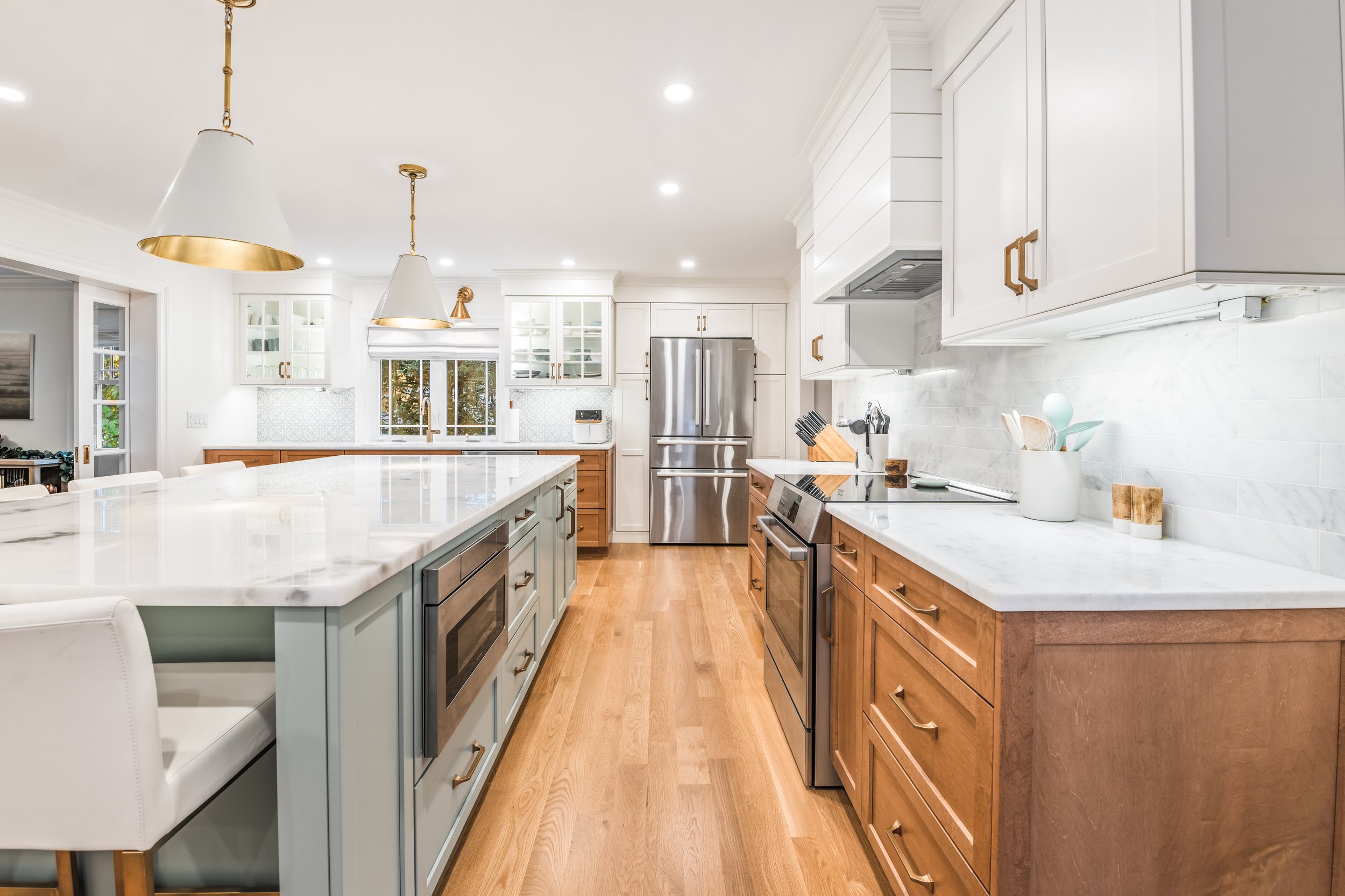Photos are by Mia Bella Photography. Also, the landscape paintings on the walls of this home are by the homeowner’s incredibly talented daughter, Jess Blazejweski.
