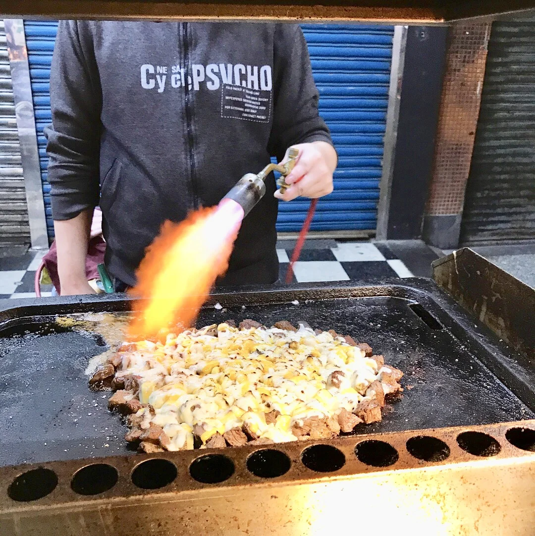 Melted cheese on blowtorched steak, yum!