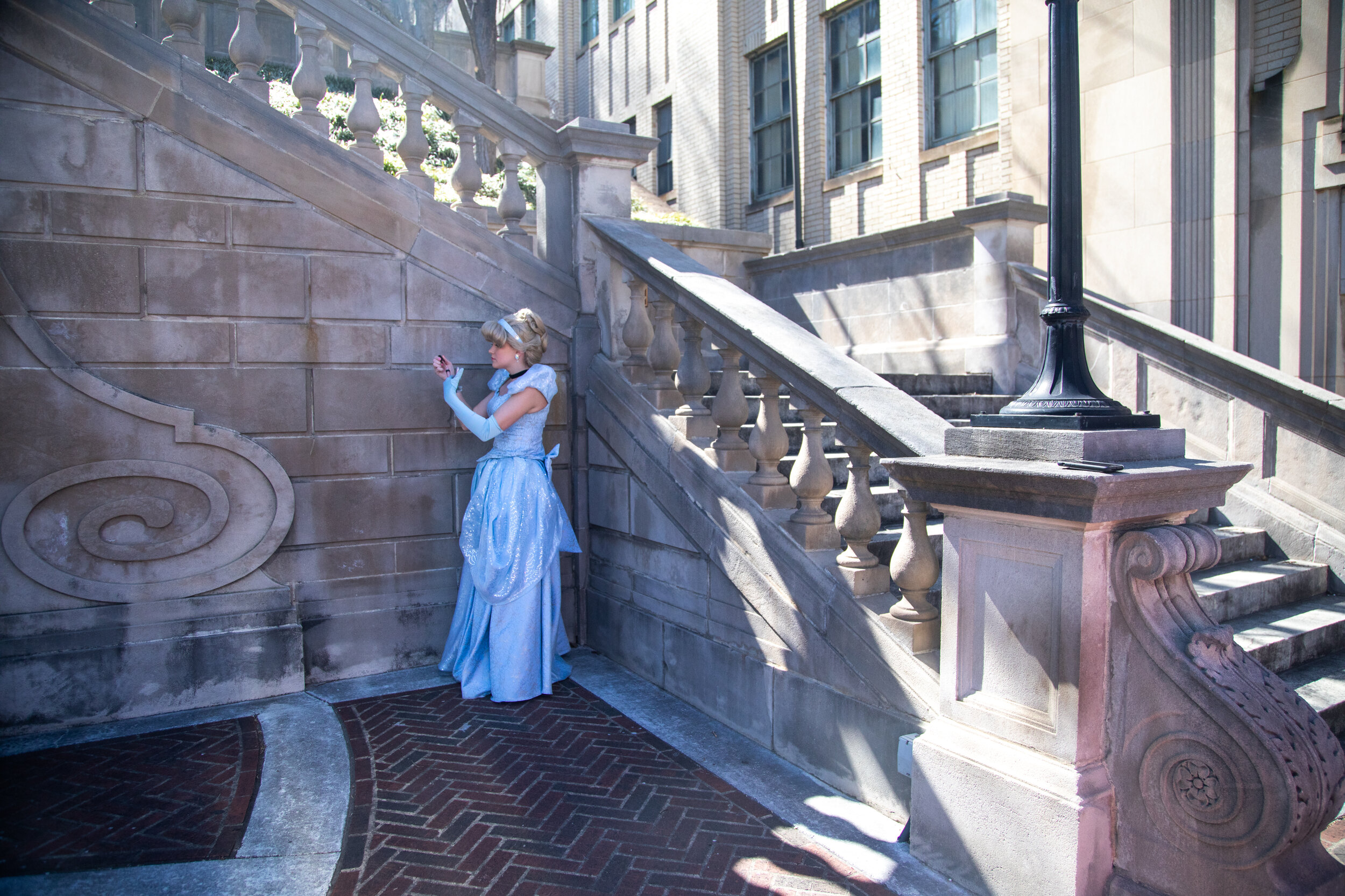  Emily Pettit from Royal Princess Virginia fixes her make-up before a group photo shoot on March 23, 2019 in Downtown Lynchburg. (Emily Elconin for The News &amp; Advance) 