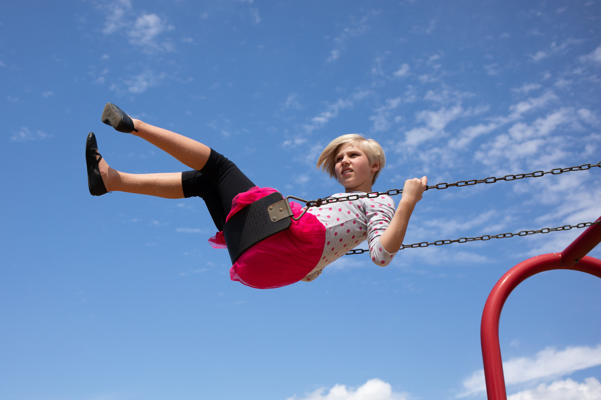  Alyssa Johnson swings in the air during a popsicle on the playground event hosted by the T.C. Miller Elementary School PTO on Sunday, August 11, 2019 at T.C. Miller Elementary School. (Emily Elconin for The News &amp; Advance) 