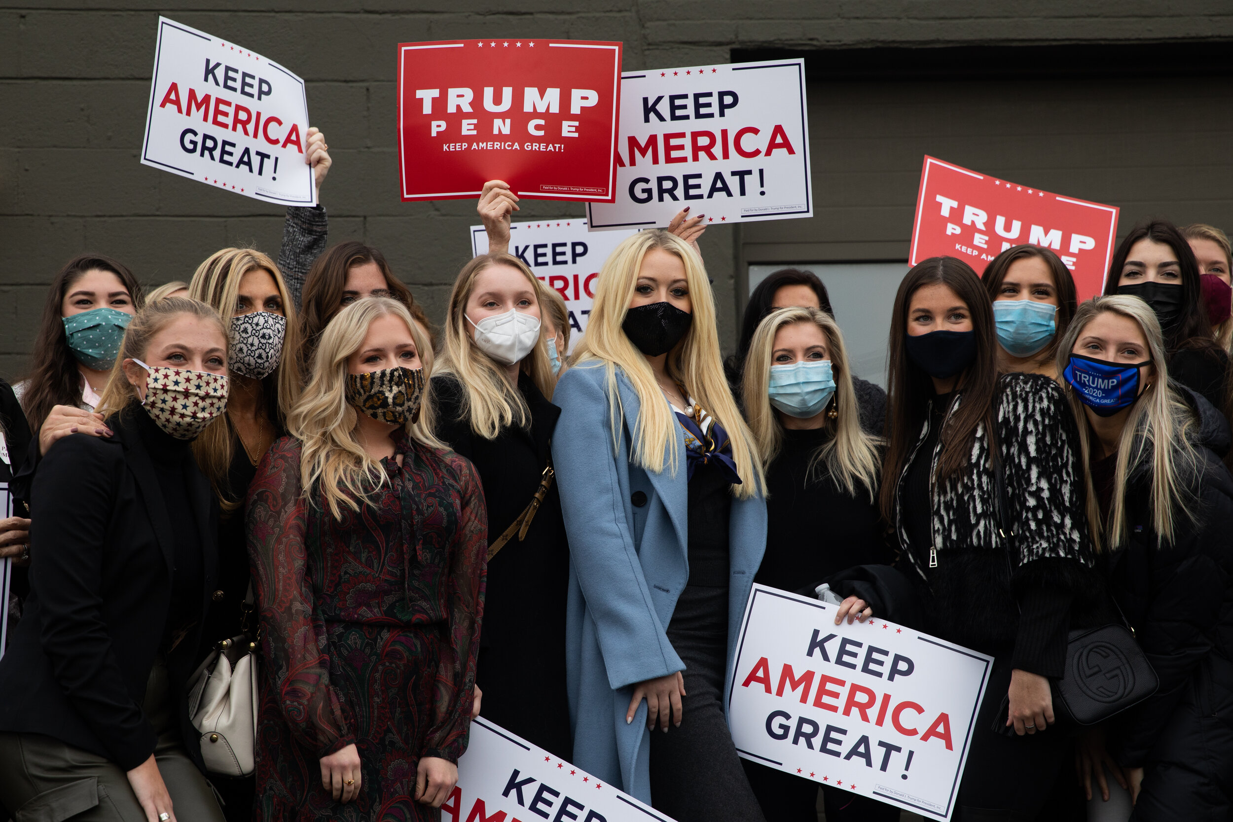  Women voters gather outside with signs for a group photo with Tiffany Trump in Birmingham, Michigan, U.S., October 29, 2020. (For Reuters) 