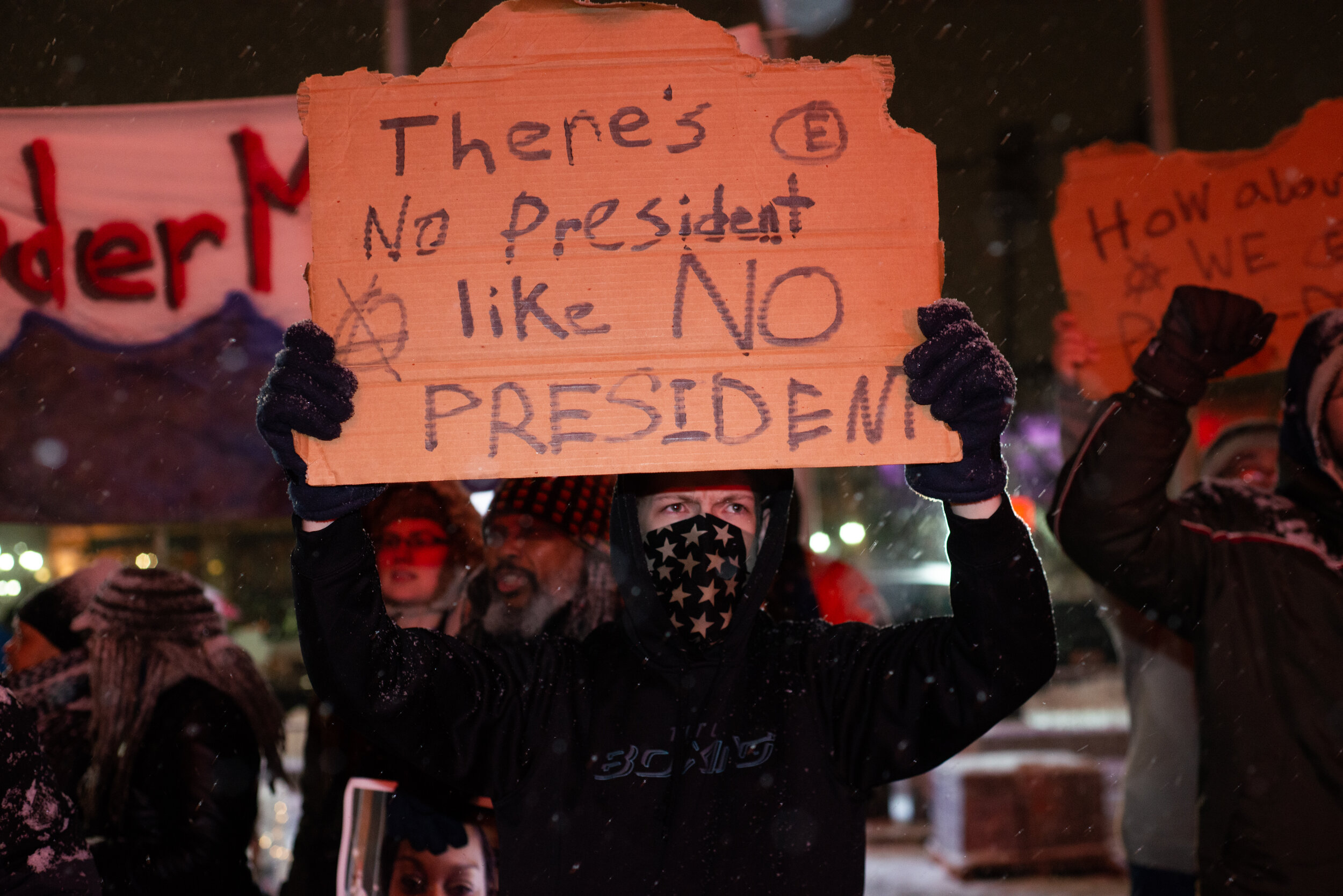  A protester holds a sign outside the Republican Presidential Debate at the Fox Theater on March 12, 2016 in Detroit, Michigan. 