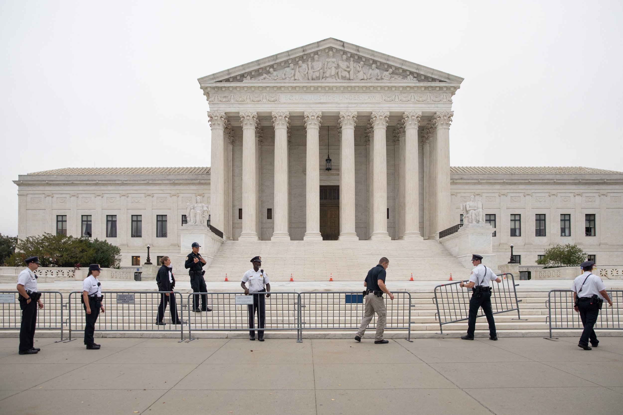  Police officers set up barricades in front of of the U.S. Supreme Court in Washington, D.C., U.S., on Tuesday, Oct. 12, 2021. Louisville's EMW Women's Surgical Center is part of the court's term that could gut the constitutional right to abortion an