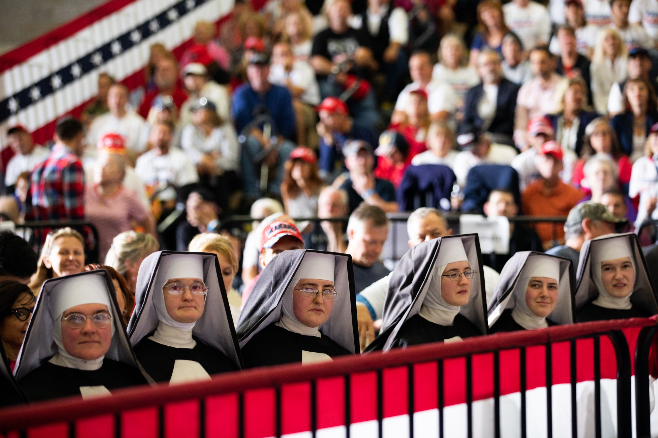  A group of woman dressed as nuns who identify as Dominican Sisters of the Immaculate Heart of Mary join supporters of Former President Donald Trump as they listen to speakers during a Save America rally on October 1, 2022 in Warren, Michigan. Trump 