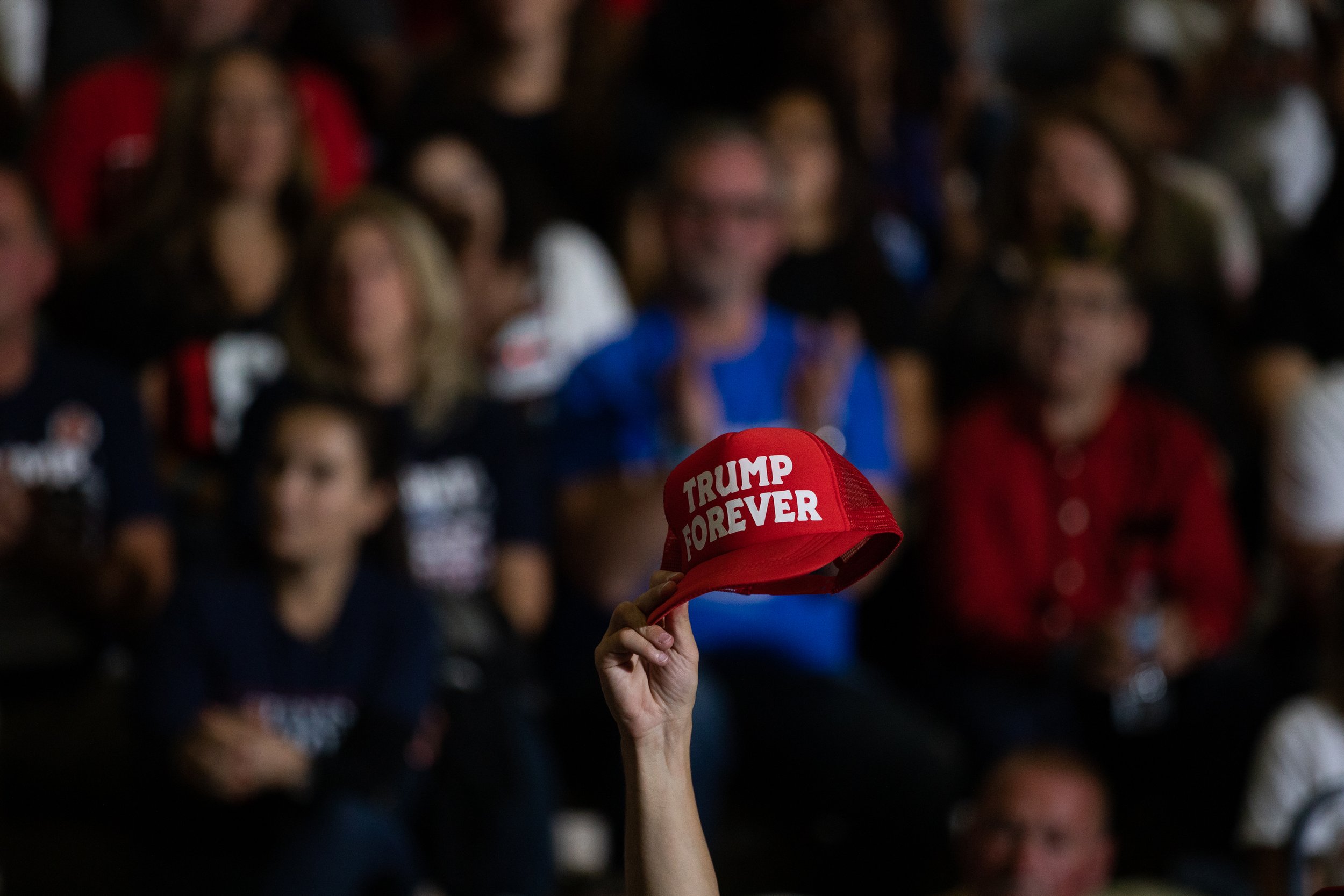  A supporters of Former President Donald Trump raises their hat in the air during a Save America rally on October 1, 2022 in Warren, Michigan. Trump has endorsed Republican gubernatorial candidate Tudor Dixon, Secretary of State candidate Kristina Ka