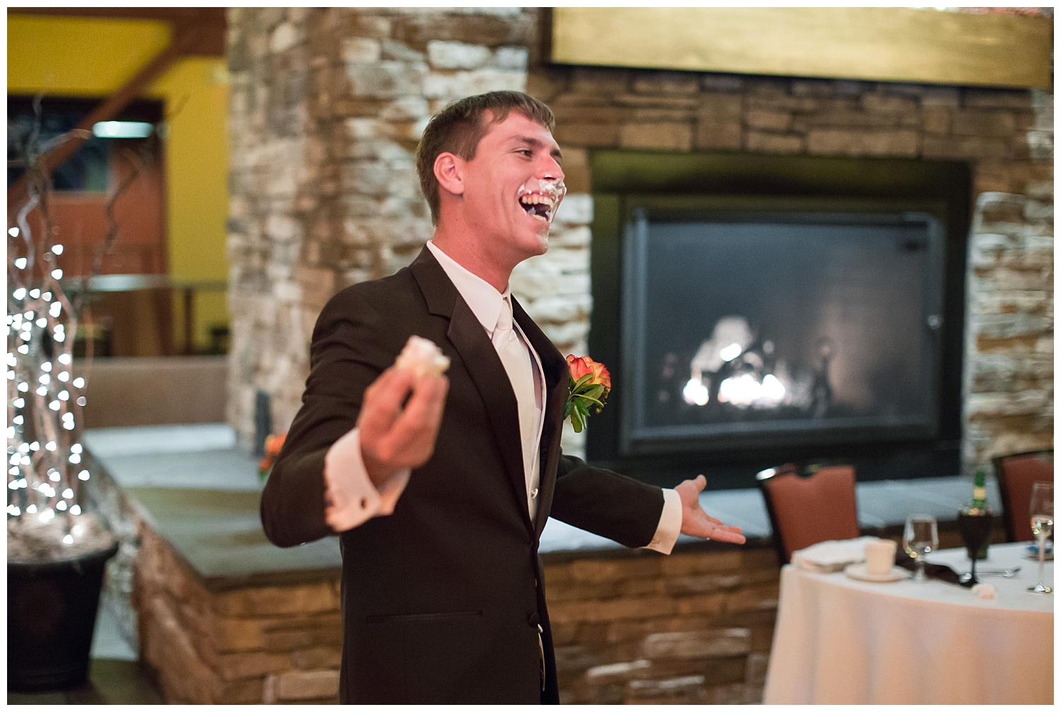 groom with cake on face