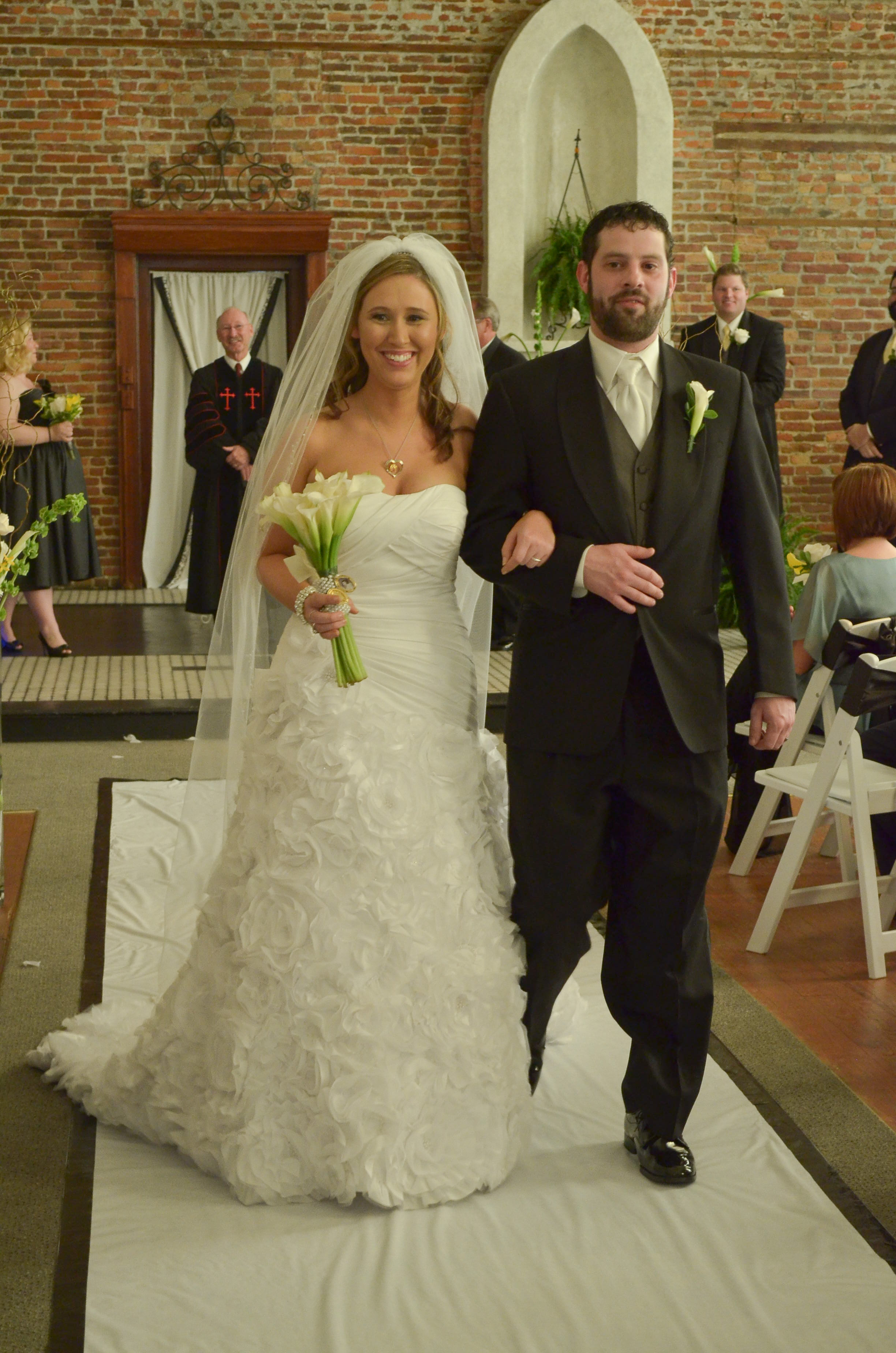 Bride and groom walk.