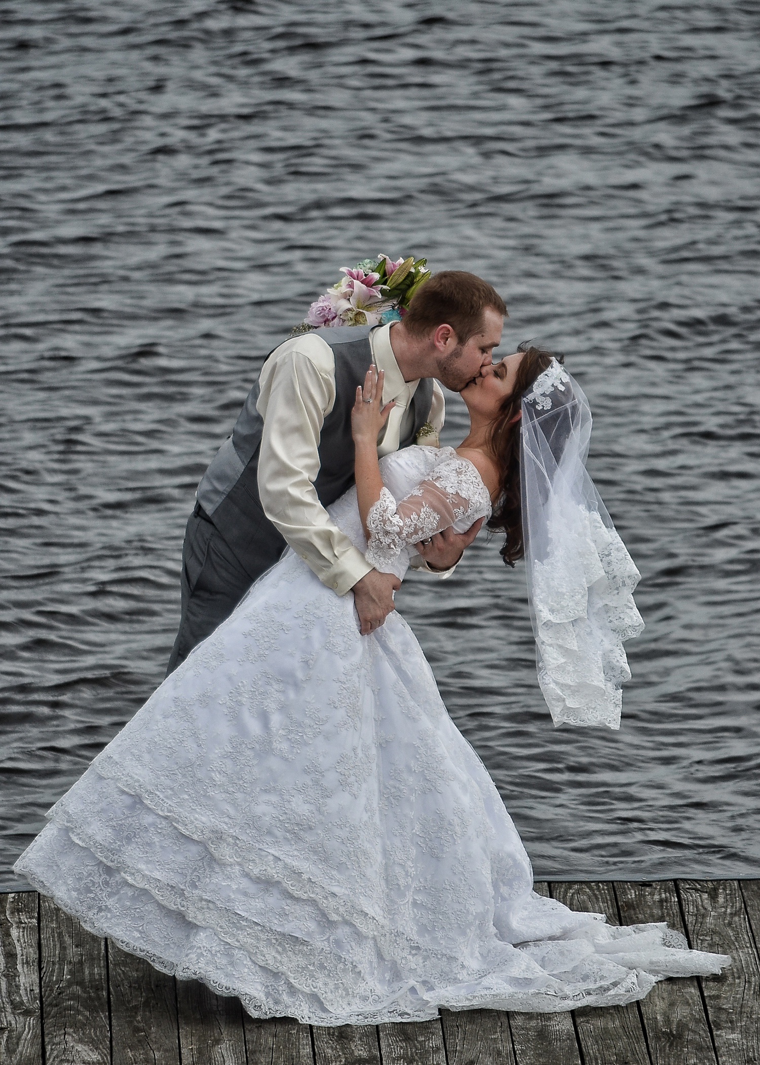 Bride and Groom kiss.