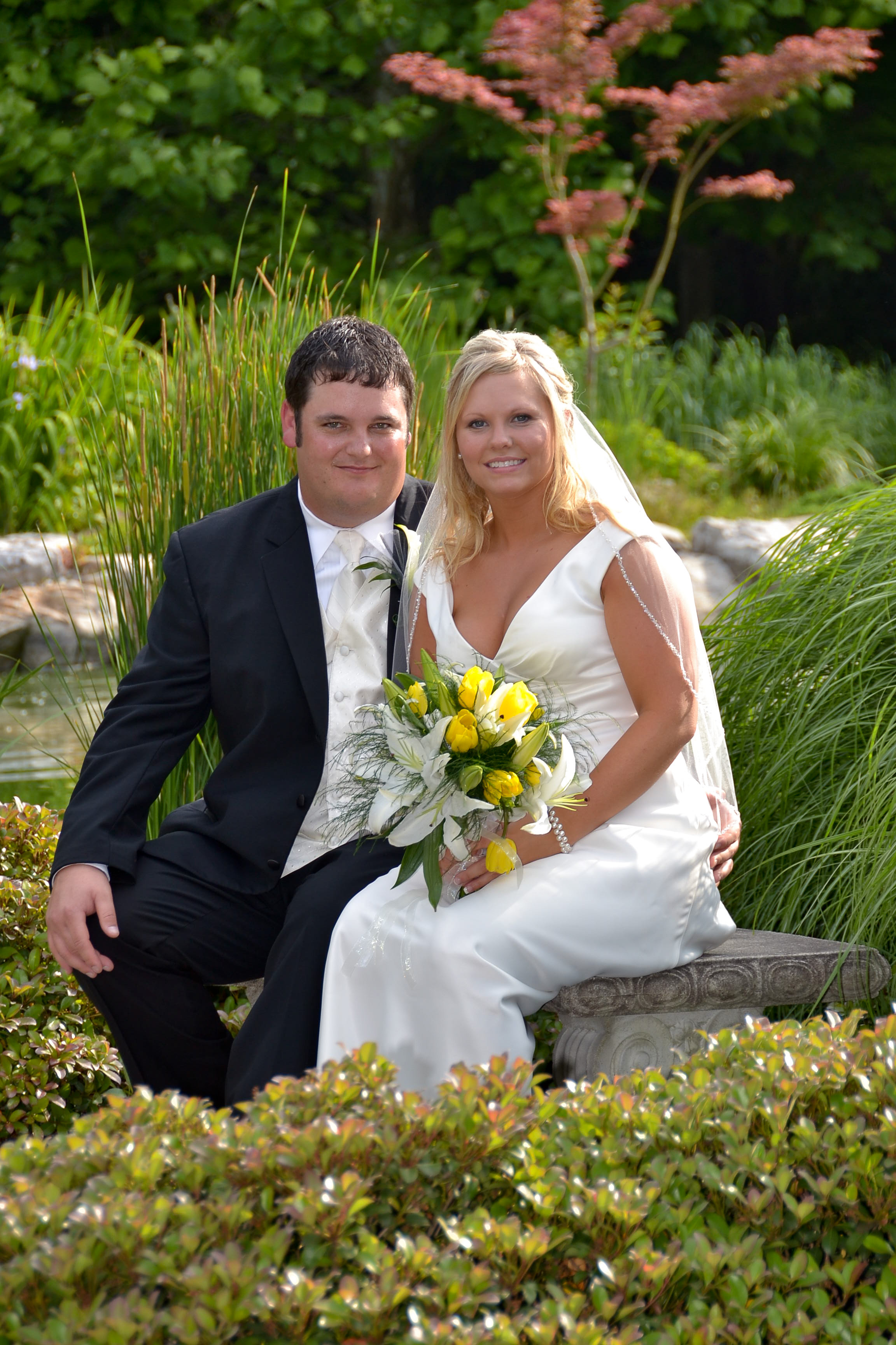 Bride and groom posing for the camera.