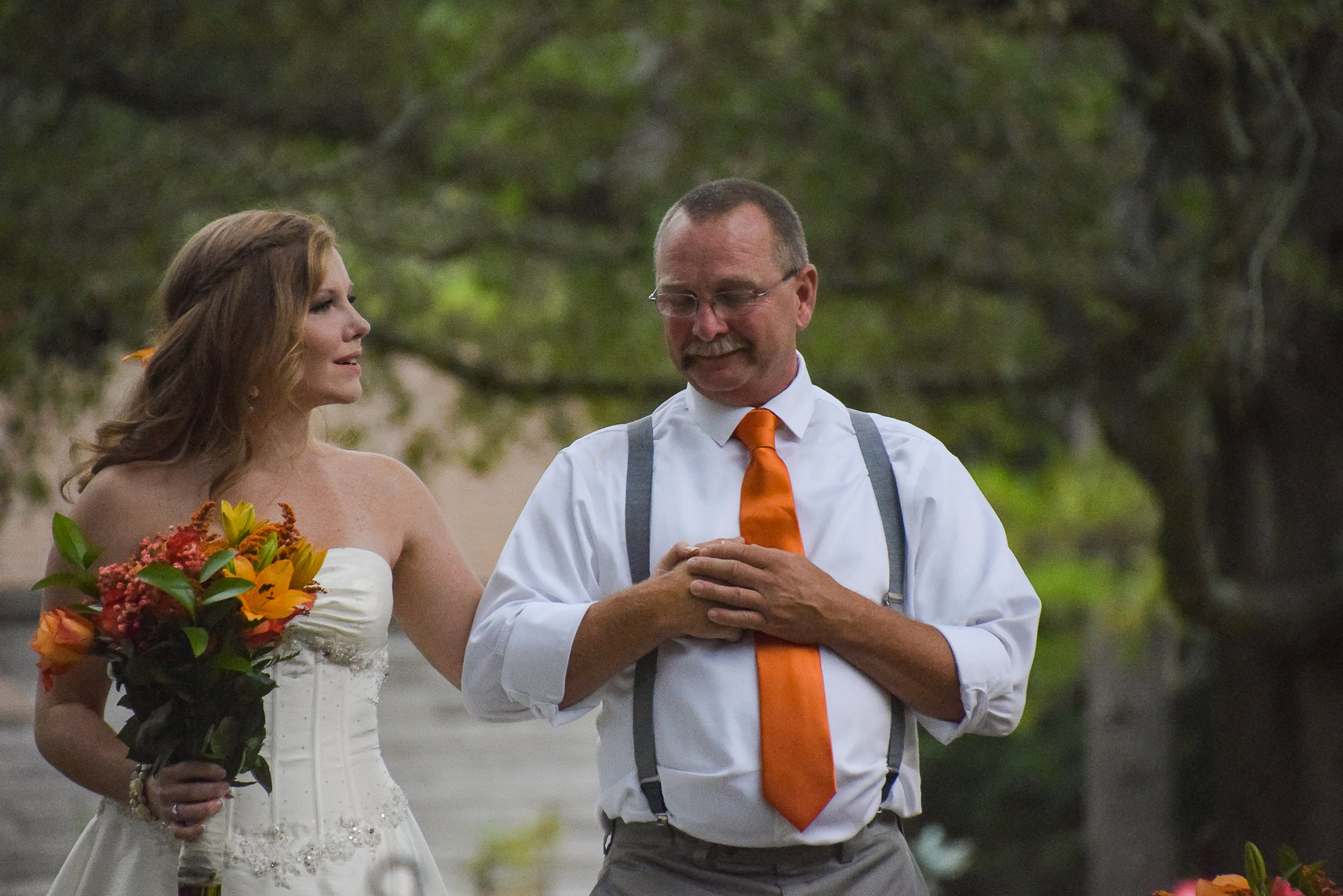 Bride walking down the aisle with father.