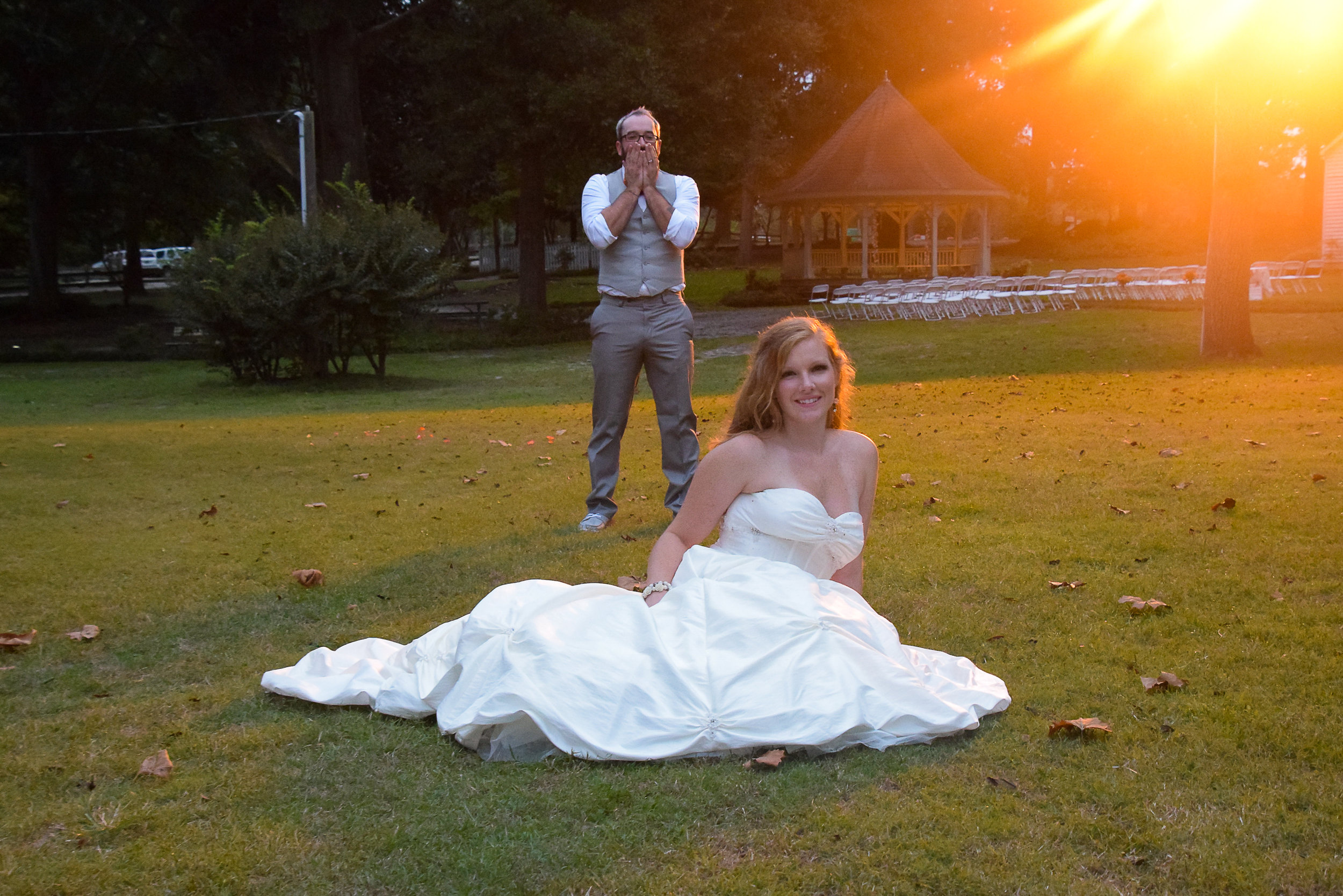 Groom standing in awe of his bride.