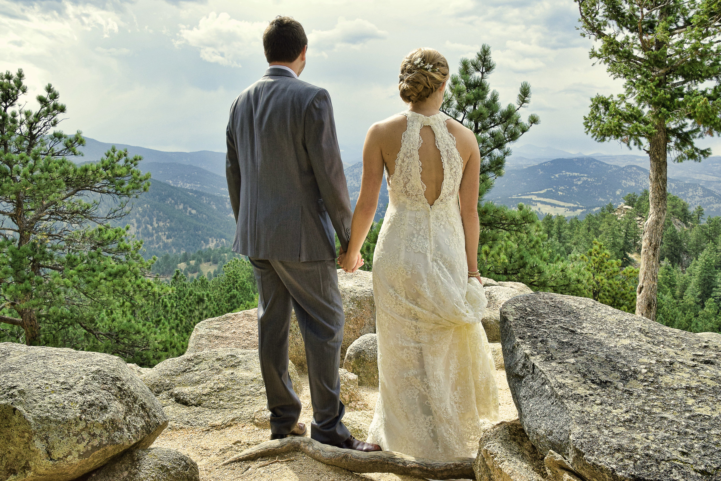 Candid shot of bride and groom in Rocky Mountains.