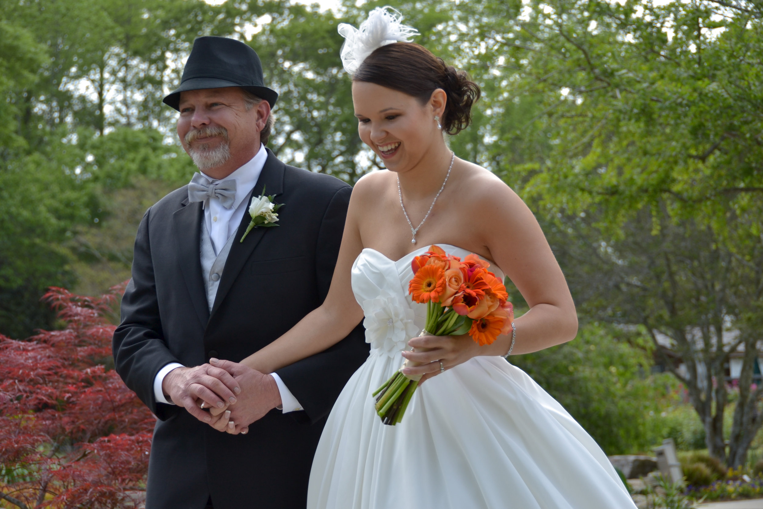 Candid Shot of dad walking daughter to wedding.