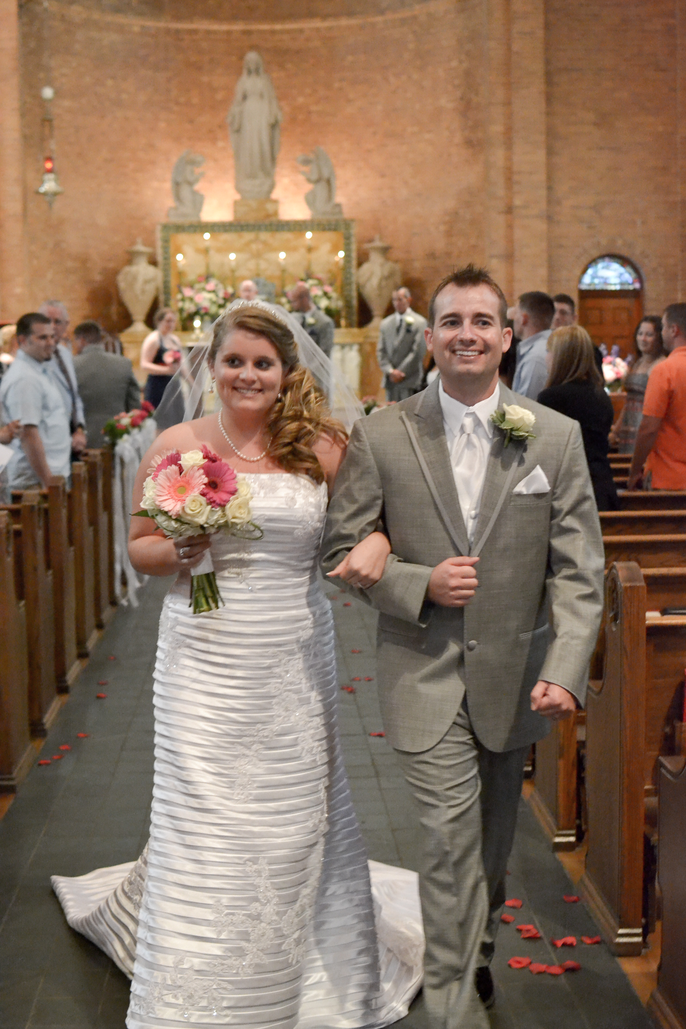 Bride and Groom walking up the aisle at St. Mary's Basilica.