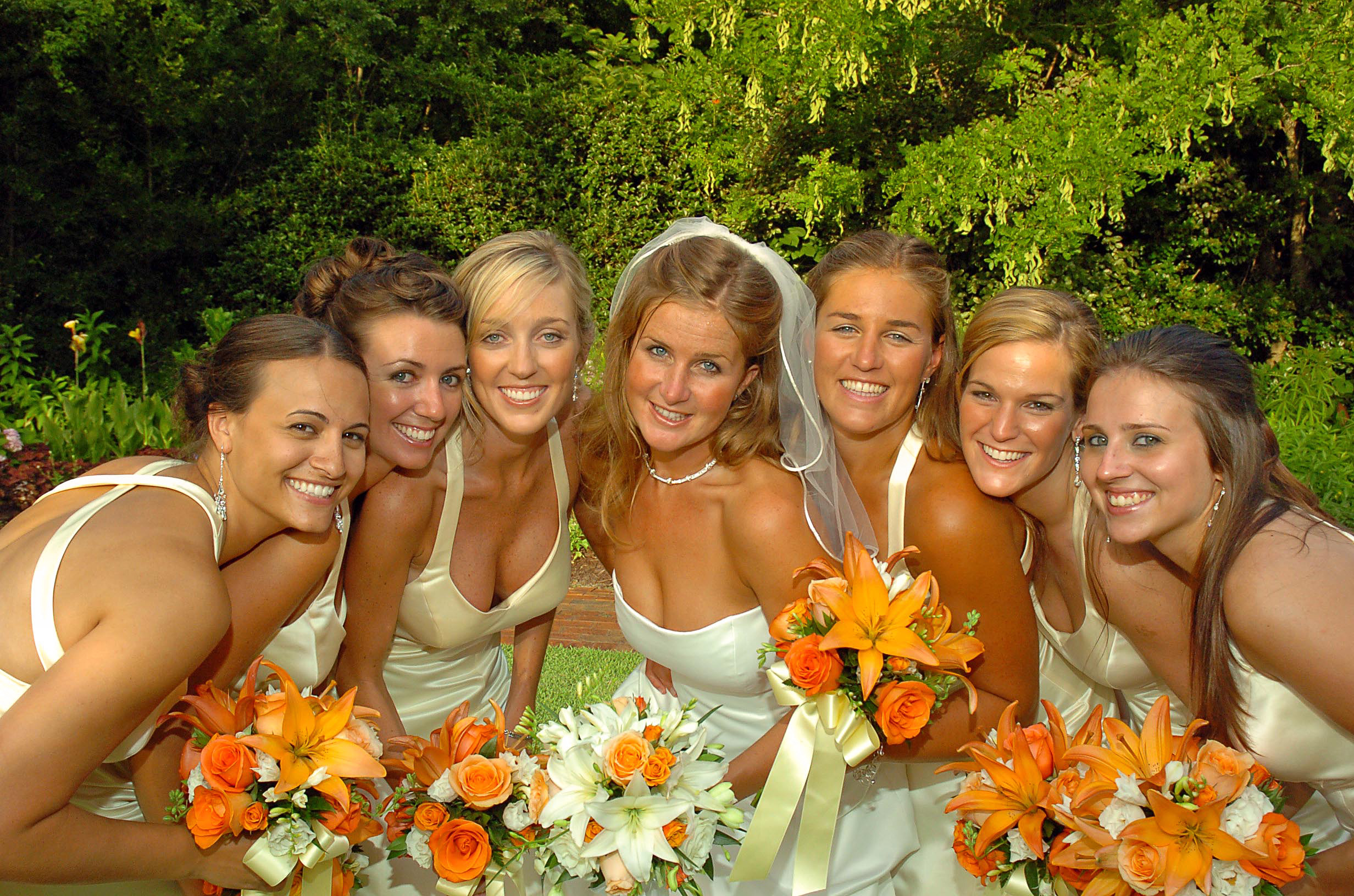 Bride and bridesmaids posed photo.