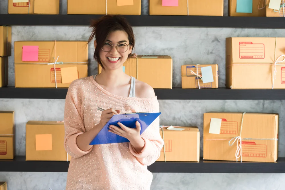 girl-labelling-boxes-for-ecommerce-sales-in-office.jpg