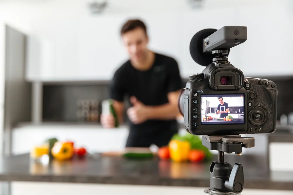 man-in-kitchen-taking-photos-for-blogging.jpg
