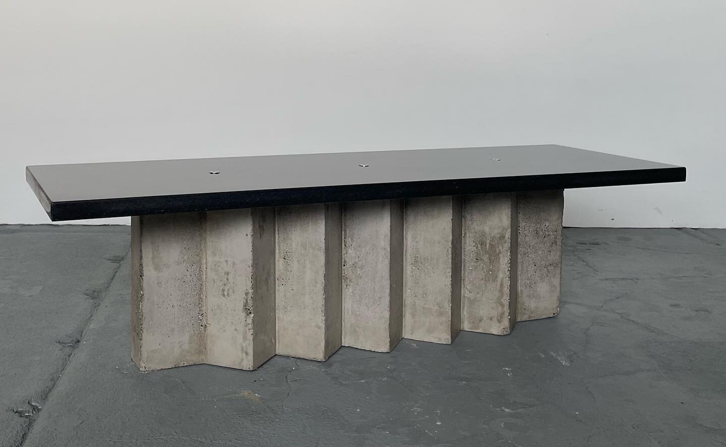 Public Housing Table #1, cast concrete, stainless steel and black granite. This Brutalist coffee table is inspired by a minimalist interpretation of NYC&rsquo;s public housing. Often viewed from the Williamsburg bridge the Baruch Houses were built in