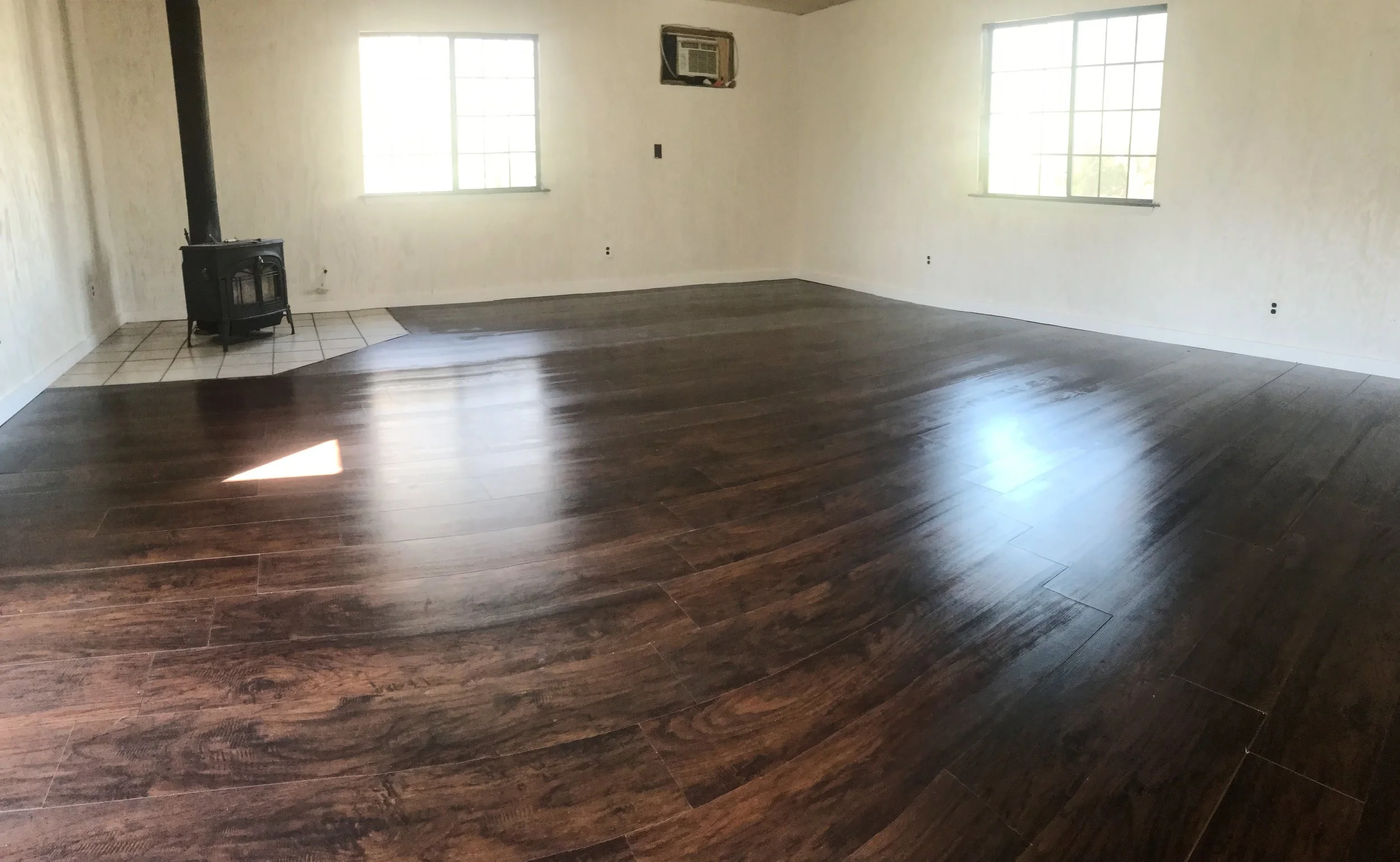 Laying wood laminate flooring saves a lot of money, but is a HUGE pain.