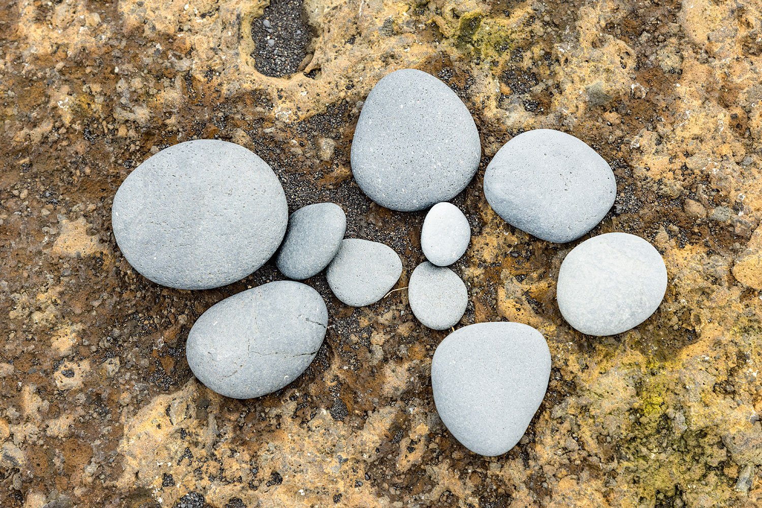 Pebbles on Rock. Vik, Iceland, 2022