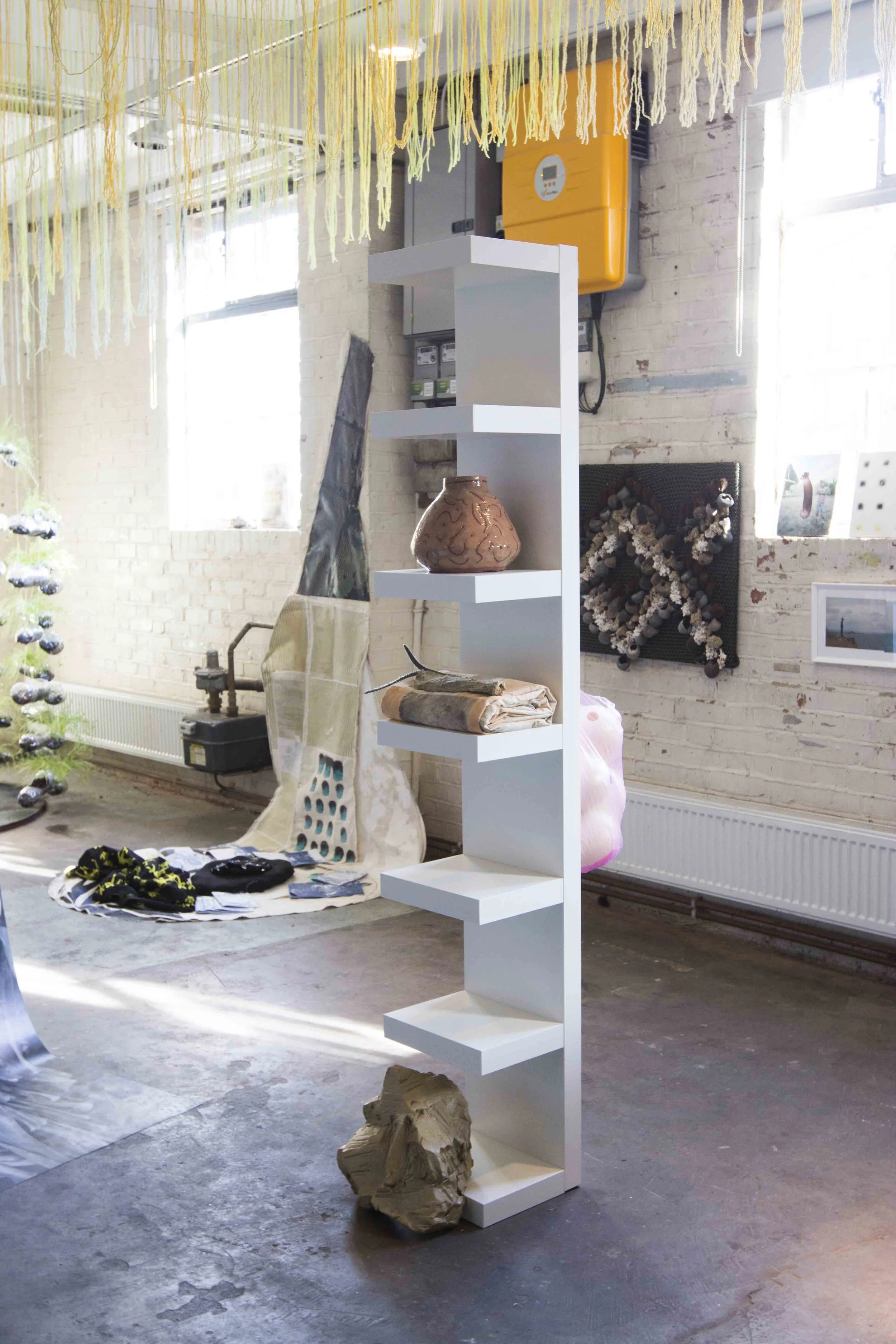 DOMESTICATED OBJECTS, Camilla Reyman, 2018. cactus, natural pigments on fabric quilt, plastic bag, ceramic pot, stoneware mask, ikea shelf, ostrich eggs. Tropic 08ºN