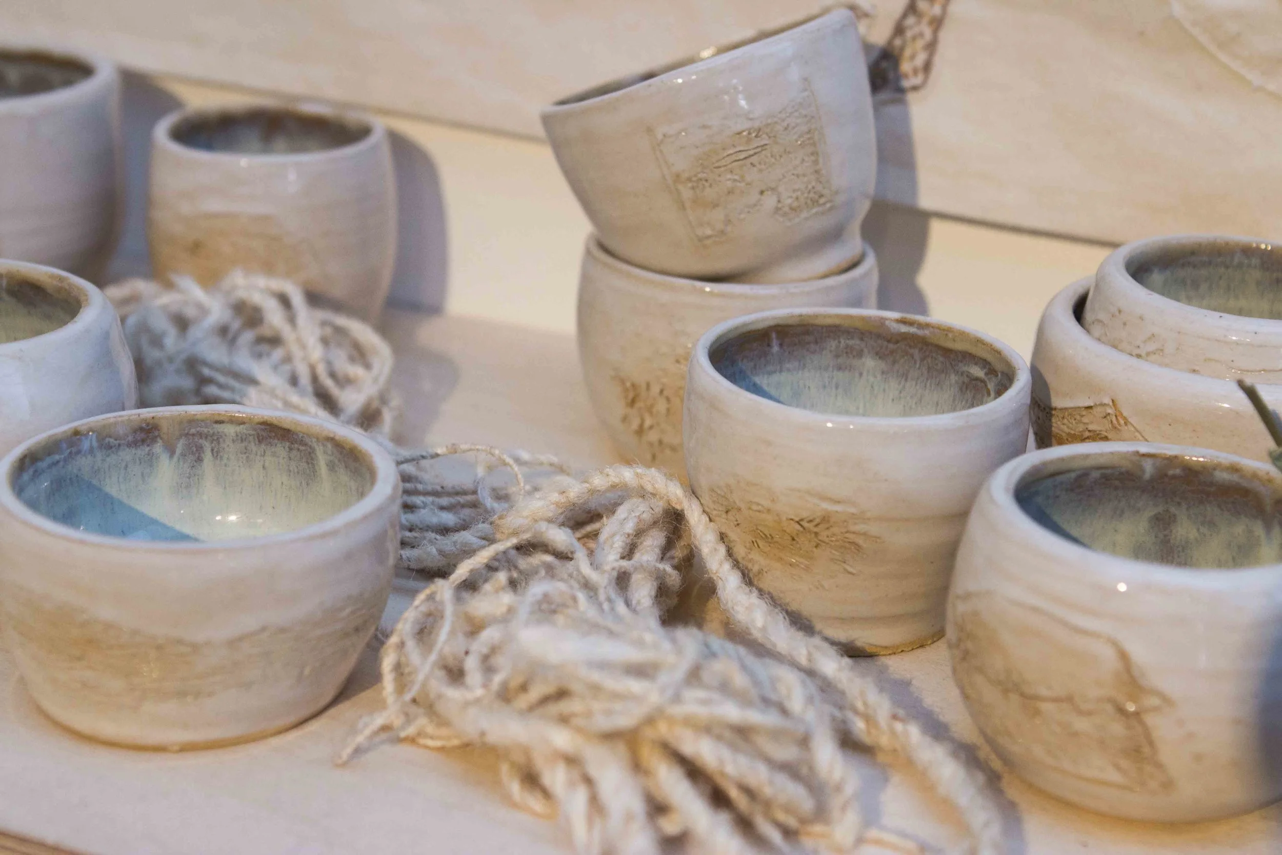 BIG MOUTHED BOYS SHALL NOT TAKE ME ON, Amy Leung, 2018. tapestry, cotton flower, tin thread, hand thrown ceramic cups. Arctic 70ºN