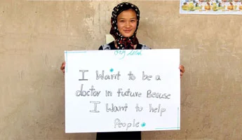 A young Afghani woman shares her dream of attending a university and becoming a doctor. (Photo via JRS, Bashir A. Behzad)