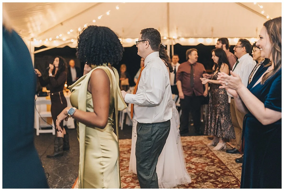 Guests dancing at wedding reception and enjoying the night.