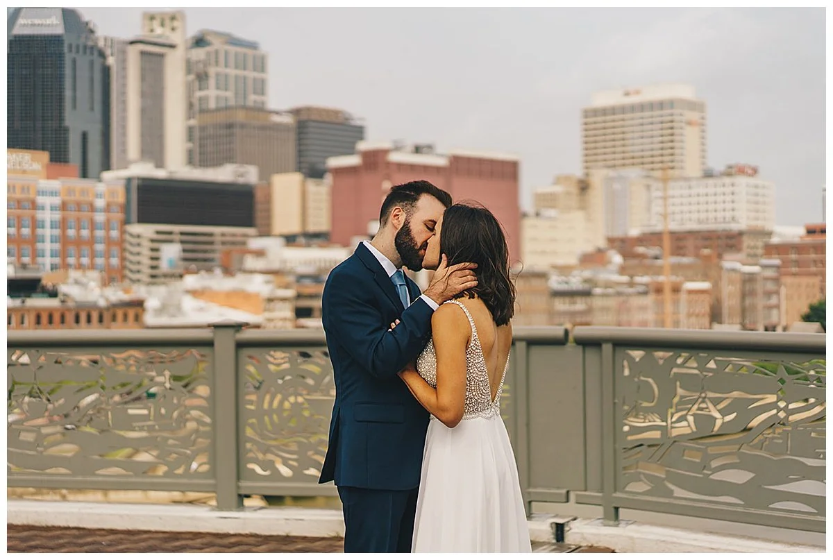 Couple taking portraits during their downtown Nashville wedding