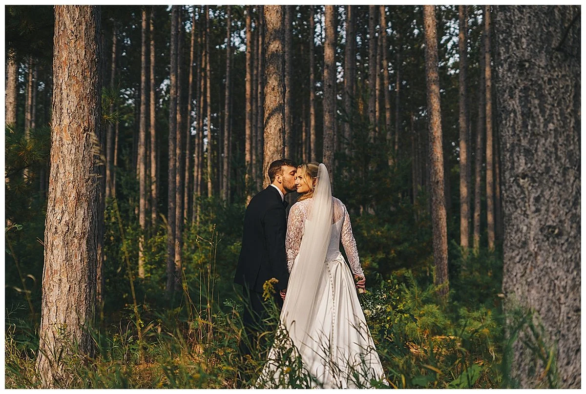 Couple in woods at BlueBridge Event Center