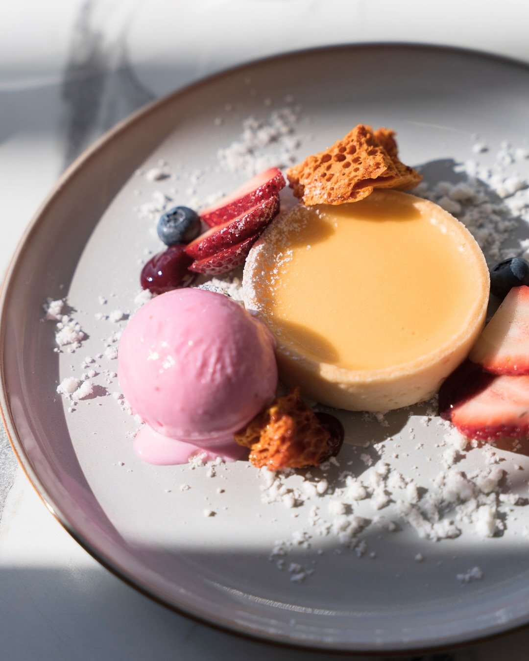 Sweet Treats, Boardwalk Bistro Style 🌊

💛 Lemon Tart
Bright, bold, and beautifully plated&mdash;this stunner features a velvety lemon curd in a crisp shell, paired with mixed berries, a luscious berry compote, strawberry ice-cream, airy lemon snow,