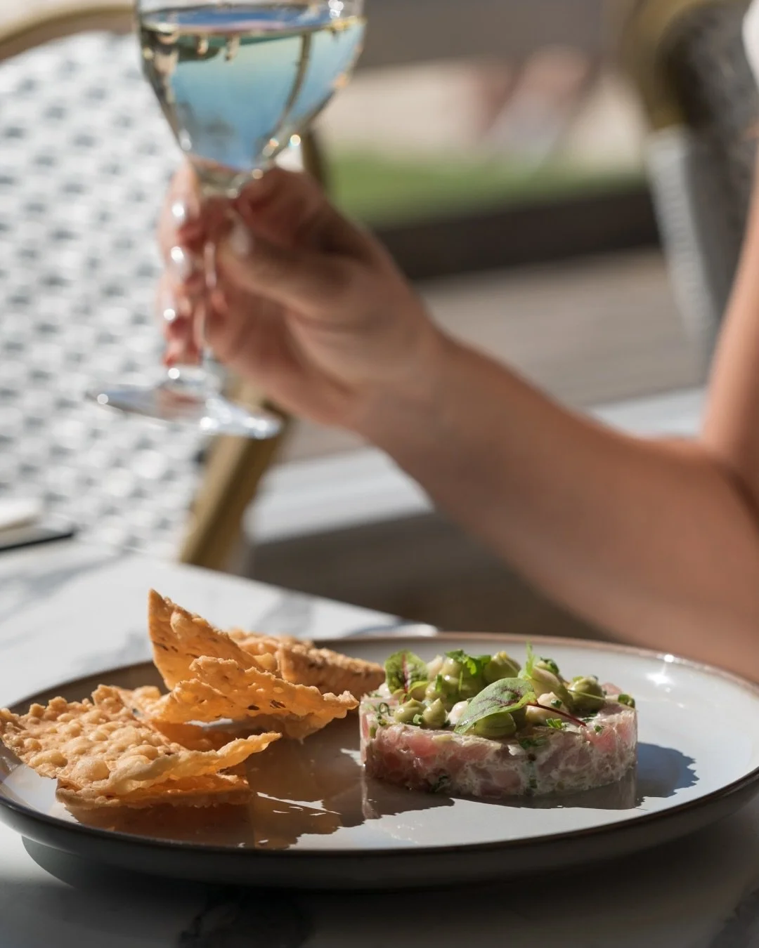 Our tuna tartare is a holiday season favourite &mdash; delicate tuna paired with a crunchy nepalese namkin cracker, rich bottarga, silky anchovy emulsion, and smooth avocado pur&eacute;e.
Fresh, festive, and full of flavour, perfect for summer dining