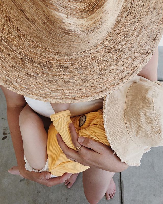 Poolside in mamas arms. ☀️