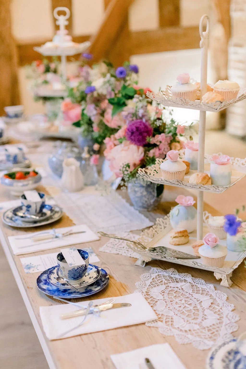 Luxury wedding table styled with vintage china, pastel flowers and elegant glassware