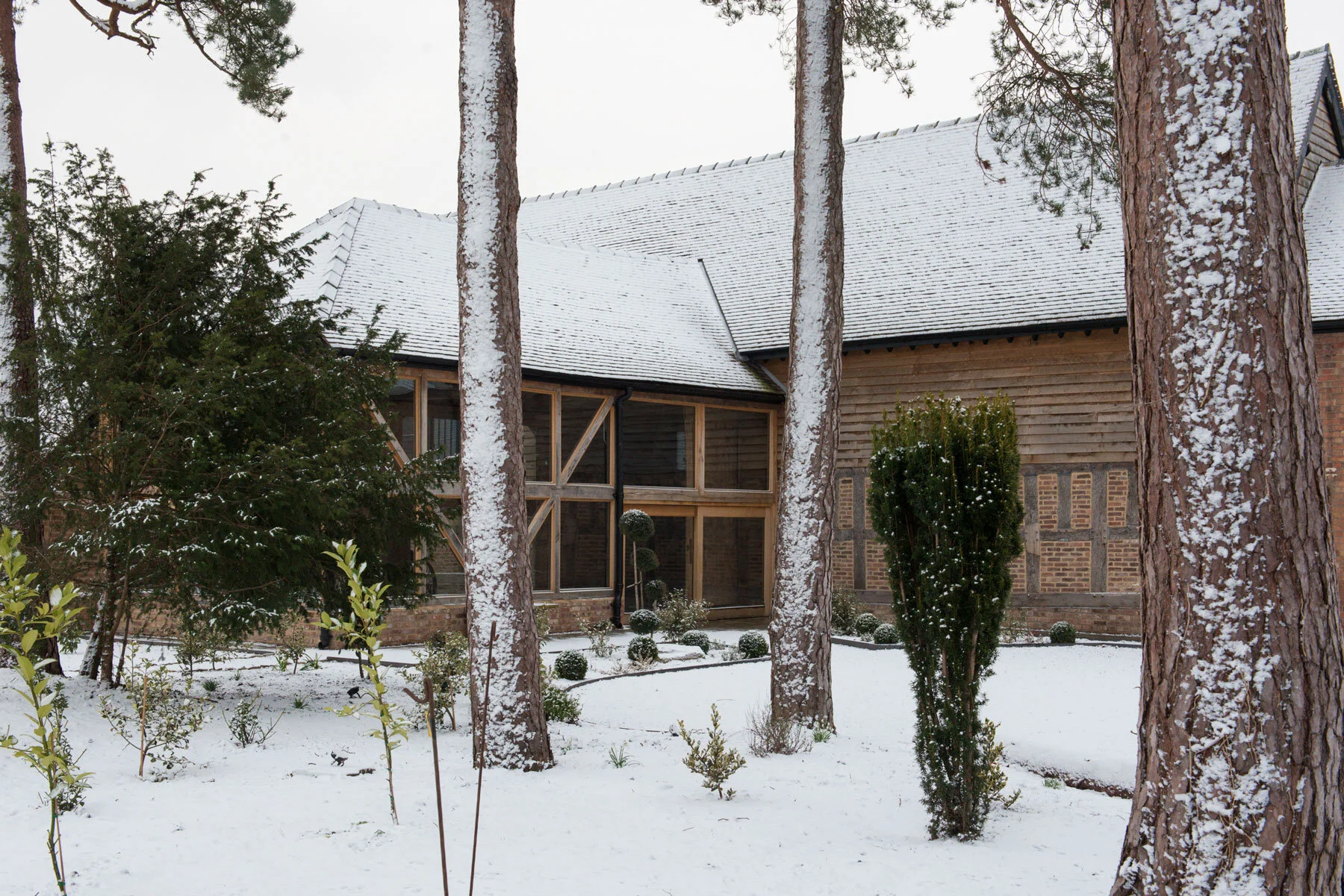 Snow covered grounds and roofs of the barns