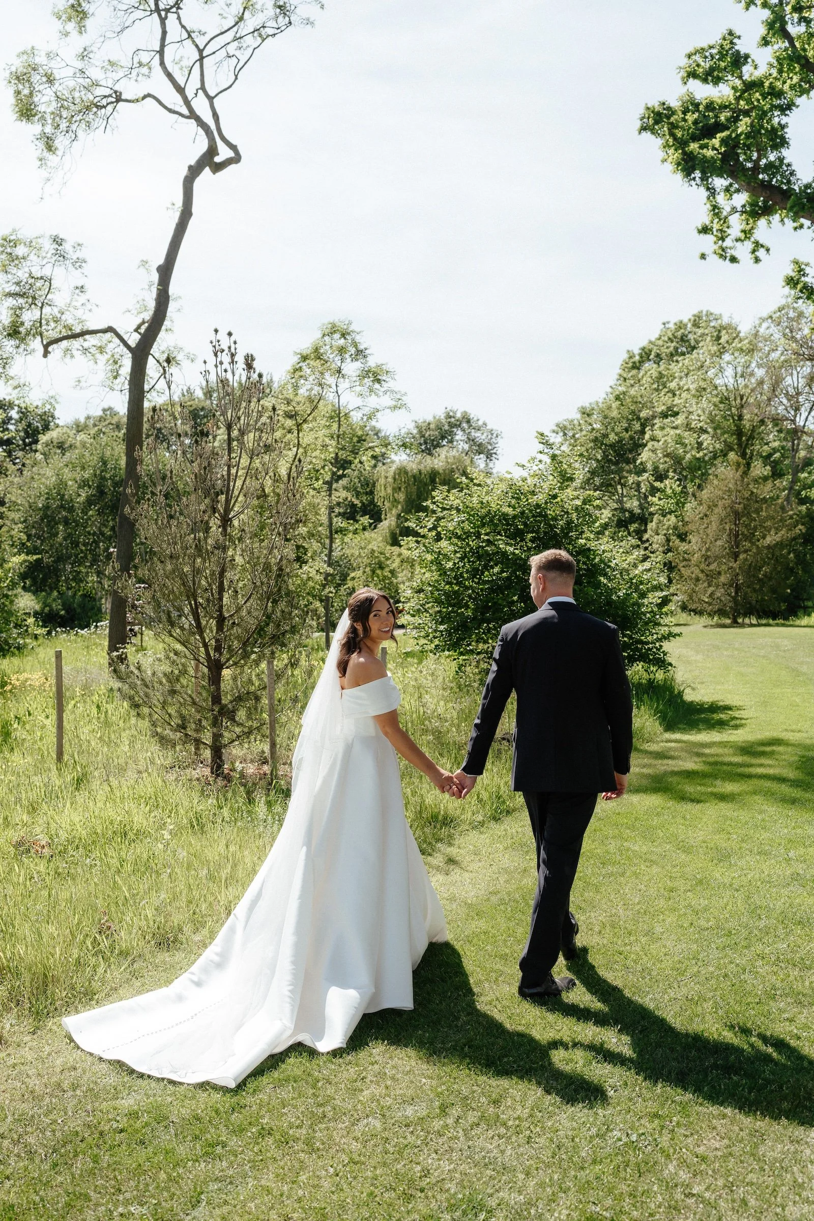 GraceDoveNewlyweds Walking Through the Grounds.jpg