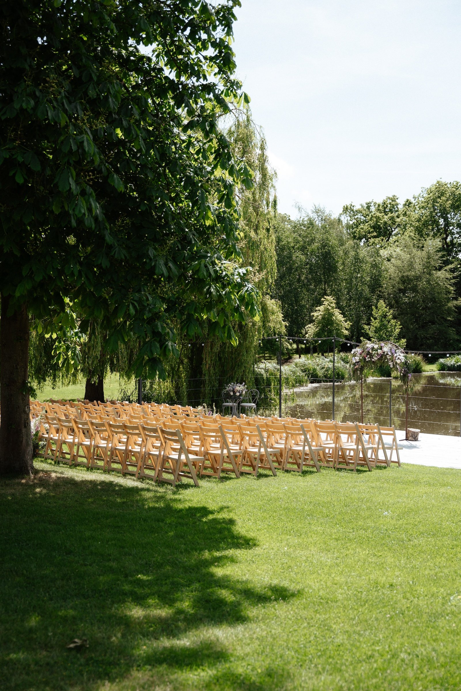 GraceDoveOutdoor Ceremony Setup by the Lake.jpg