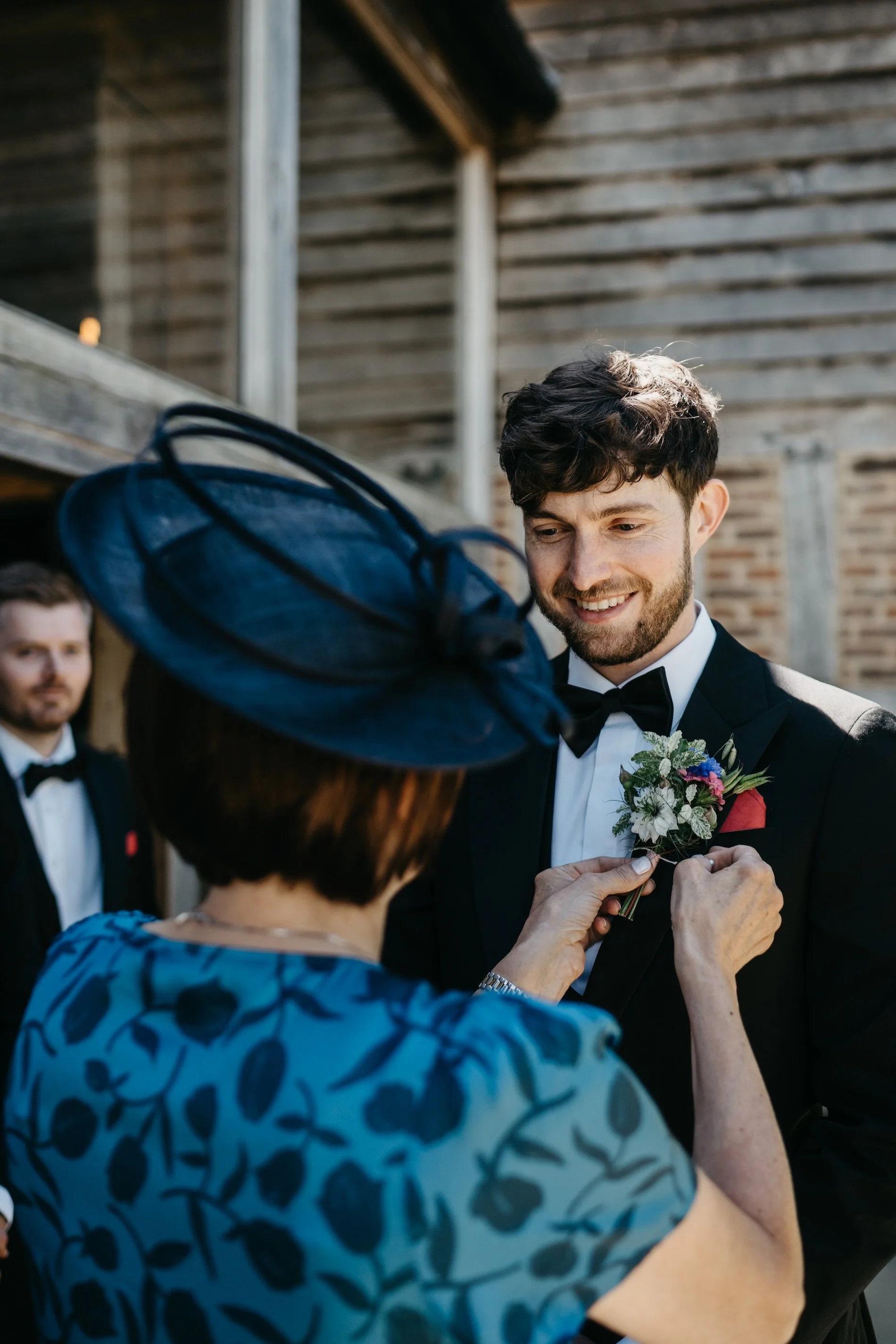 PinholeadjustingAllieTomWedding.jpg