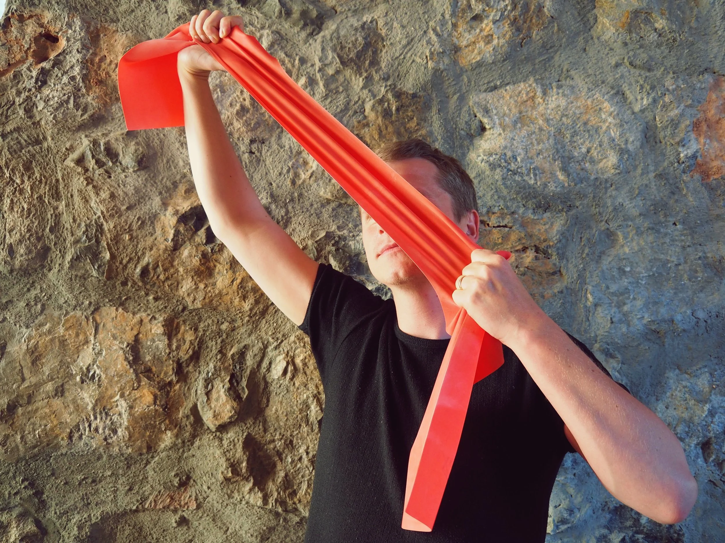 And here we have my lovely assistant Vincent demonstrating the power of the resistance band.